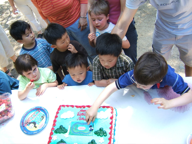 Kids around the Cake